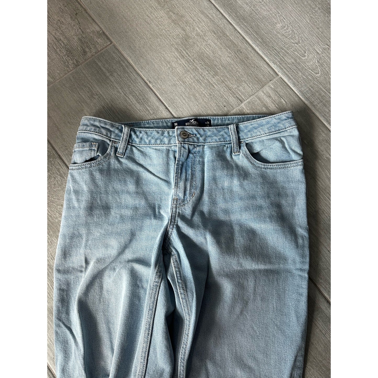 Size 9R Hollister jeans. Light denim with dark blue patches, with rips. 29W 31L